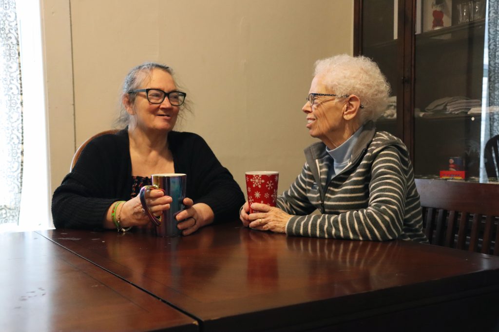 A DLAH client and Sister Vickie Perkins enjoy a visit.