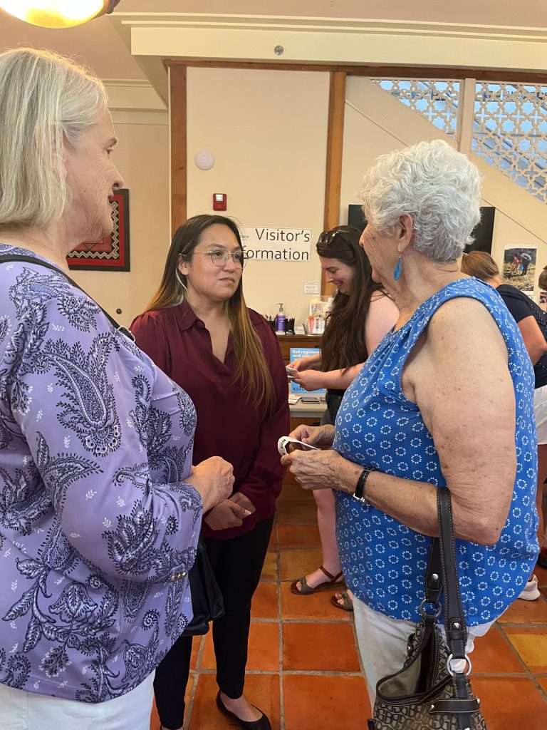 Ashley Hernandez speaks to participants in prayer vigil