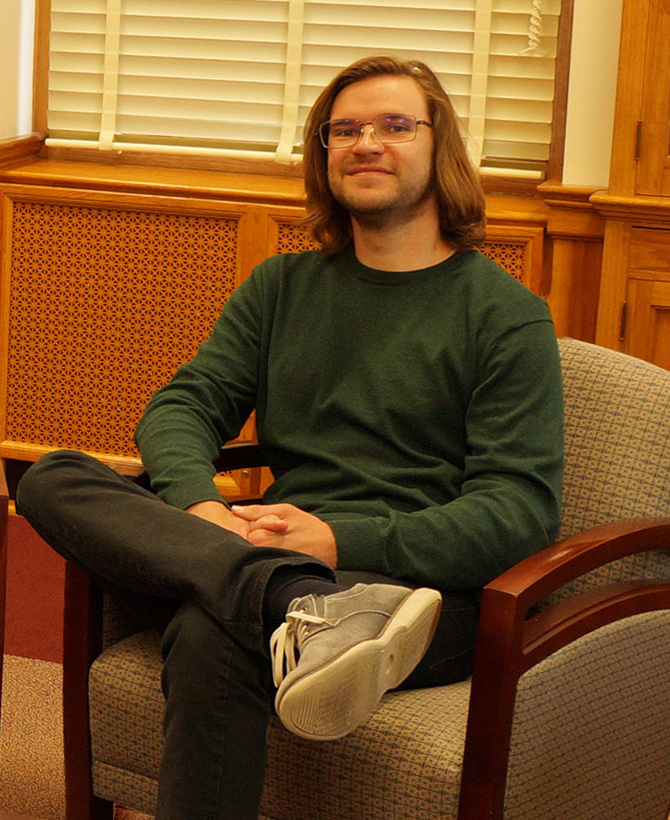 image of a man sitting in a chair