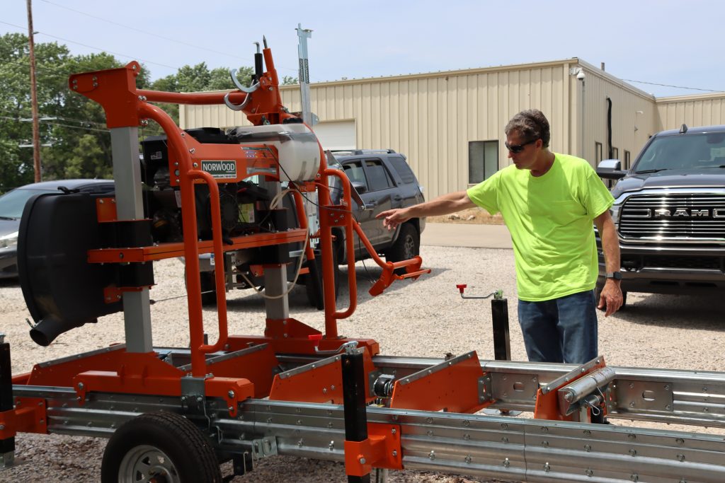 image of a man working with a wood planer