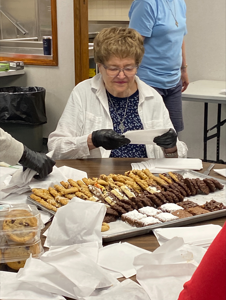 image of woman packing cookies into bags
